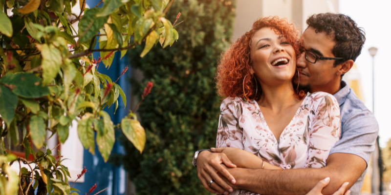 Relaxed couple outdoors embracing each other