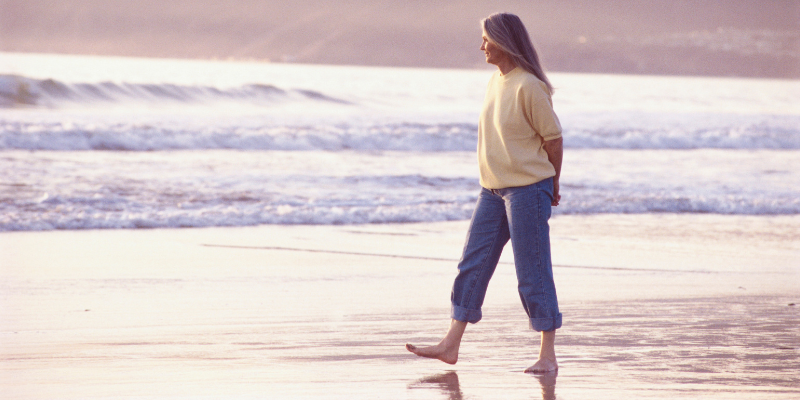 Menopausal women walking by the water