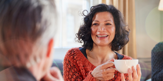 Menopausal woman talking over coffee