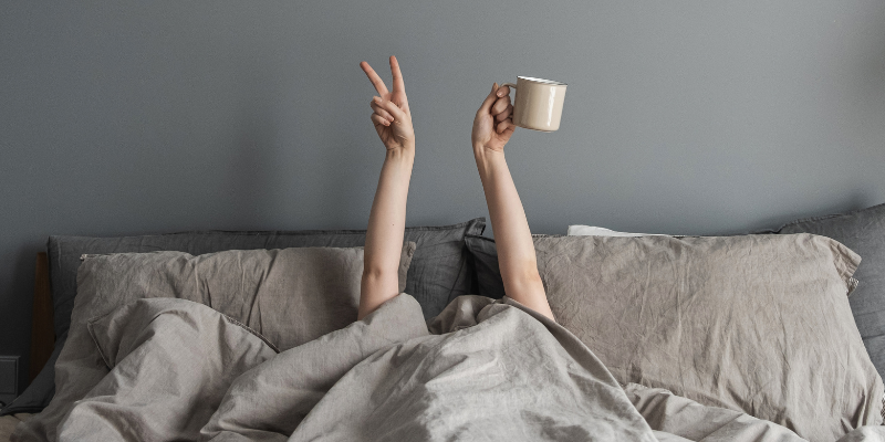 Woman relaxing in bed not having sex