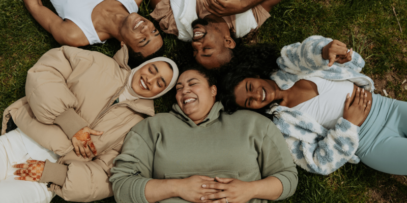 People laughing celebrating International Woman’s Day