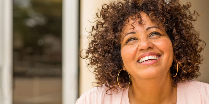 mature women smiling and reflecting 