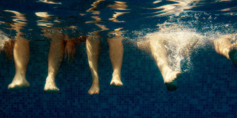 Legs underwater representing lubrication