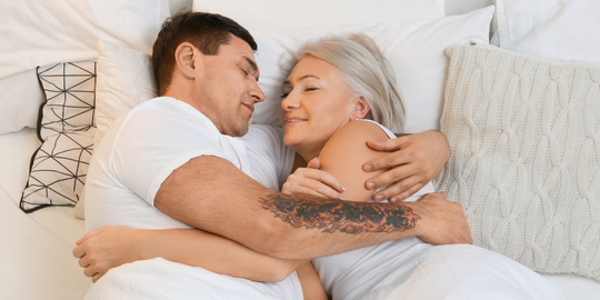 Menopause woman hugging supportive partner