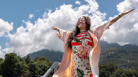 Happy woman with arms in the air 